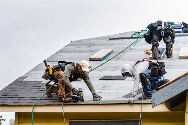 Professional Gutter Installation technician working in Kewadin, MI